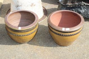 A pair of circular planters. 1ft 4ins diameter.