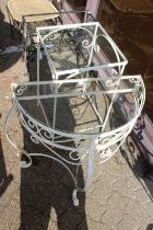 Two white painted glass top tables.
