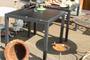 A pair of square tables.
