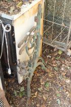 A pair of cast iron garden bench ends.