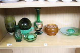 A shelf of mixed glass.