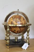 A small table, a globe of the world.