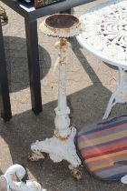 A white painted cast iron stand.