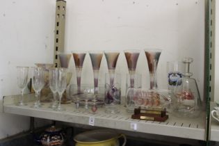 A shelf of glass including six good cocktail glasses.