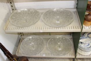 Four large glass dishes.