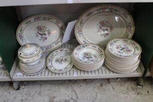 A shelf of china plates.
