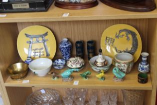 A shelf of mixed oriental china.