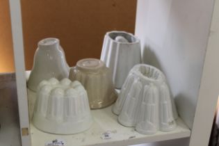 Five ceramic jelly moulds.