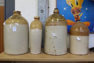 Four local earthenware flagons.