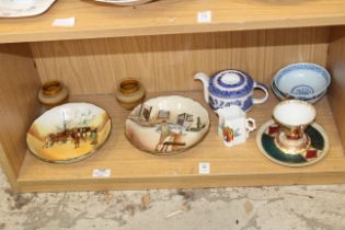 A mixed shelf of china.