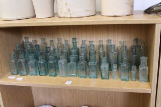 A large group of vintage small bottles.
