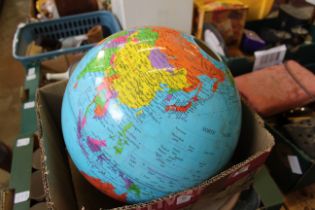 A lamp shade designed as a globe.