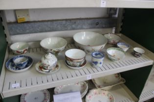 A mixed shelf of oriental china.