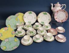 Lustre ware teapot with cups and saucers, one heavily damage repaired, Fenton green and yellow