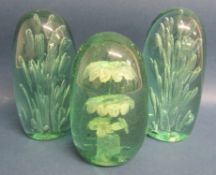 3 green glass dump paperweights