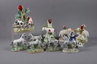 A pair of Staffordshire sheep spill vases, 5 1/2" high, a pair of Staffordshire horse figures, 5"