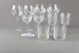 A set of six cut glass wines, two brandy balloons and other cut table glass