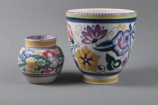 A Poole Pottery flower pot with floral decoration, 7 1/4” high, and a similar smaller Poole vase (