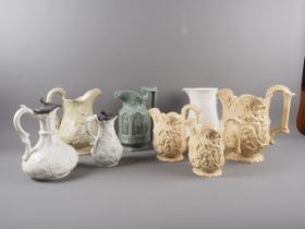 A set of three 19th century Samuel Alcock "Wisdom and Providence" relief moulded jugs, largest 8 3/