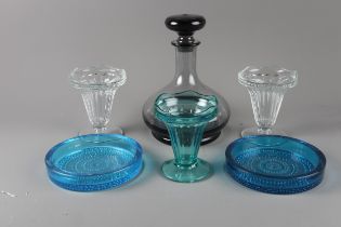 A pair of 1960s blue glass dishes, three sundae dishes and a smoky glass decanter and stopper