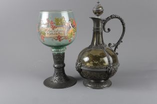 A Continental green glass claret jug with pewter mounts and stopper, 12 1/2" high, and a German
