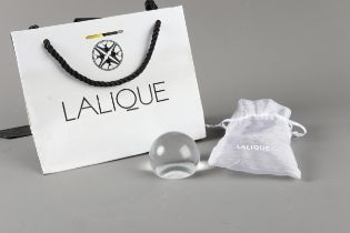 A Lalique clear glass paperweight, base with engraved nude figure decoration, 2” dia