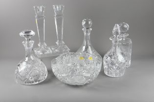 Four cut glass decanters and stoppers, a pair of glass candlesticks, cut glass fruit bowl and one