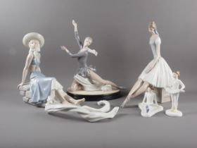 A Nao porcelain figure "Sitting on Stones", 11 1/2" high, a companion seated ballerina, 13 1/2" high