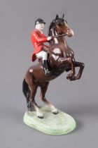 A Beswick Huntsman on rearing horse, 9 3/4" high (minute chip to ear)
