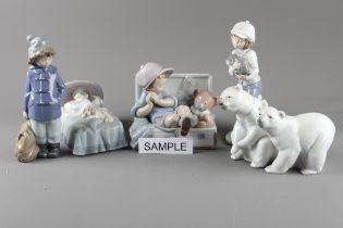 Sixteen Lladro figures including a “My favourite place” figure, two model polar bears, three
