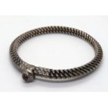 A heavy hand made bangle, no apparent ha