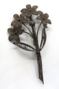 A filigree floral brooch, no apparent ha