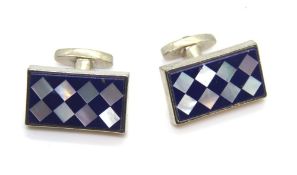 A pair of mother of pearl inlad cufflink