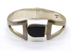 A substantial 925 silver bangle having b