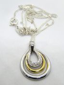 A modernist style silver pendant on silv