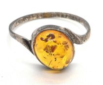 A silver and amber ring, size O-P.