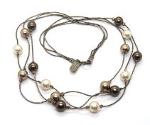 A silver and faux pearl necklace by Magn