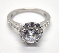 A silver and white stone ring, stamped 925, size L.