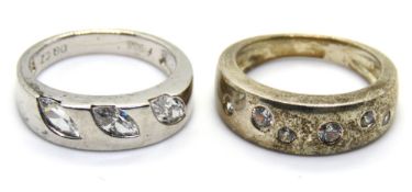 Two silver rings, size K/L.