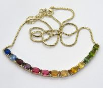 A silver necklace having articulated rai