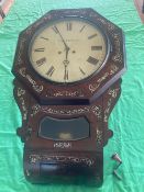 A late 19th century drop dial wall clock featuring distinctive mother-of-pearl floral inlay