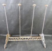 A contemporary cast iron boot rack