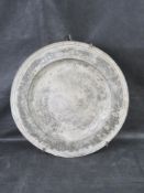 A large and impressive antique pewter charger plate having makers marks upon.