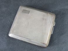A hallmarked silver cigarette case with makers mark for Trivet & Sons, HM Chester 1931, 137.1g / 4.