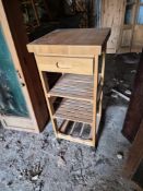 A contemporary pine kitchen island butchers block type table.