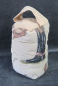 A contemporary horse riding themed fabric doorstop.