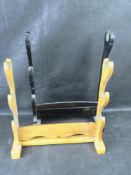 Two freestanding sword display racks.