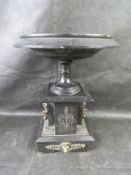 A large and impressive Victorian slate tazza of column form having brass lion head to each side.