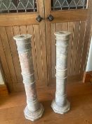 A pair of decorative carved marble pillars standing96cm high, 26cm wide at base.
