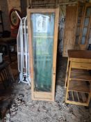 A vintage gun display cabinet.